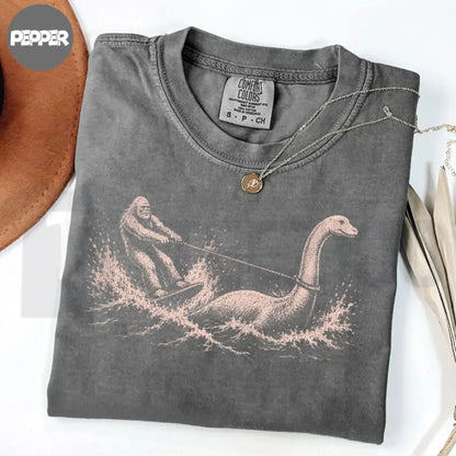 Funny Bigfoot Loch Ness Waterskiing Comfort Colors Shirt – Retro Cryptid Tee