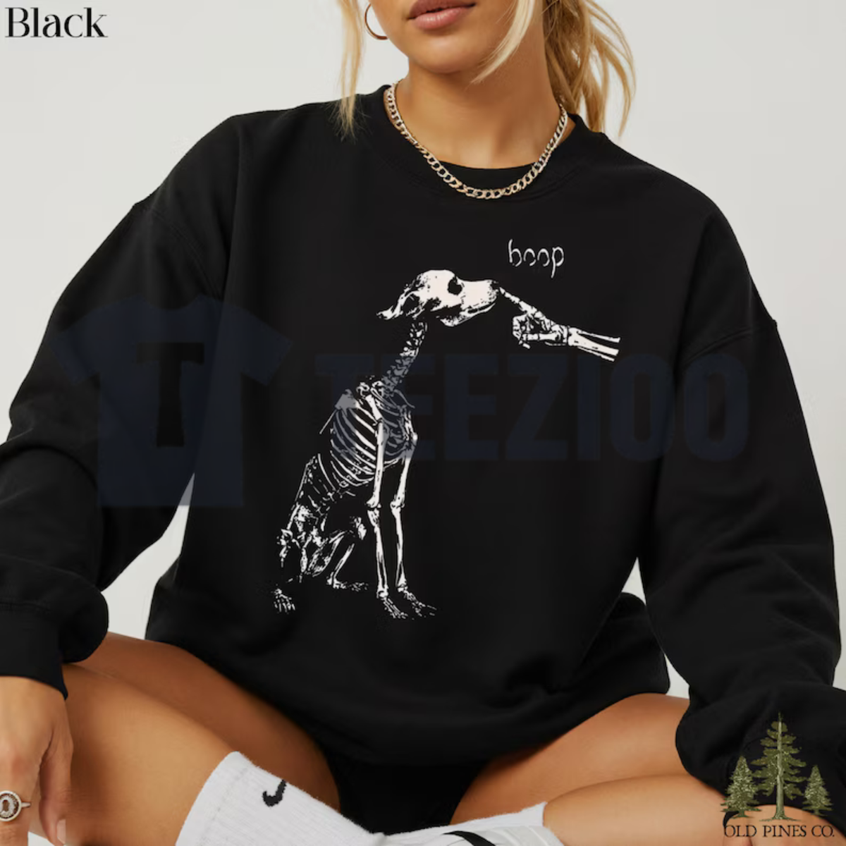 Front view of Funny Boop Dog Skeleton Halloween Sweatshirt styled in a cute fall outfit with denim jeans and boots - teezioo