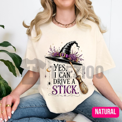 Front view of Yes I Can Drive A Stick Witch Shirt styled in a cozy fall Halloween outfit - teezioo