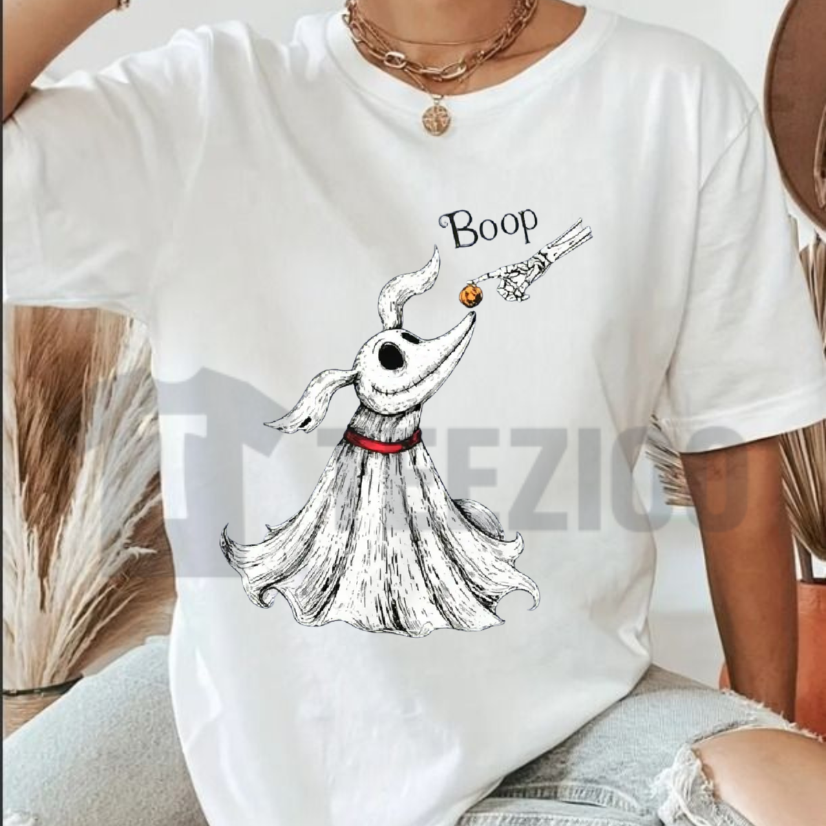 Front view of Zero Dog Boop Skeleton Hand T-Shirt styled in a cute Halloween theme park outfit with denim jeans and sneakers - teezioo